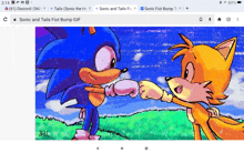 a sonic and tails fist bump gif on a screen
