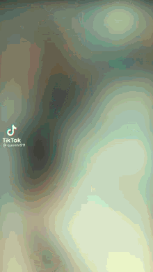 a tiktok video with a swirl of colors