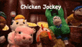a group of stuffed animals are sitting on a couch with chicken jockey written above them