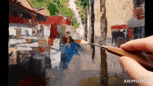 a person is painting a picture with the words made in animatica on the bottom right