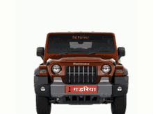 a mahindra jeep with a red license plate that says i
