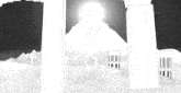 a black and white drawing of a pyramid with the sun behind it