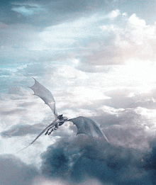 a dragon is flying through the clouds with its wings outstretched
