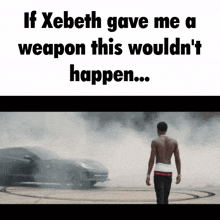 a shirtless man is walking in front of a car with smoke coming out of it