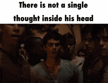 a group of men are standing in a dark room with the words there is not a single thought inside his head