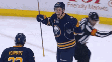 a hockey player wearing a jersey with the number 23 on it
