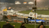 a race with a sign that says 132 on it