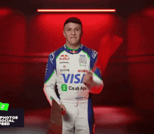 a man in a racing suit with visa cash app written on it