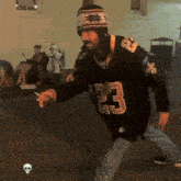 a man wearing a jersey with the number 23 on the front