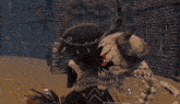 a skeleton with horns is holding a snake in his mouth in a video game .