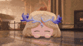 a cartoon character with antlers on her head is laying down