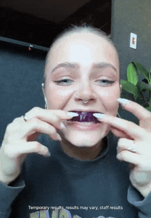 a woman is holding a purple object in her mouth with the words temporary results results may vary staff results below her