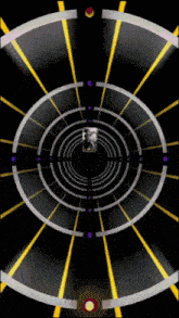 a black background with yellow and purple circles and a red circle in the middle