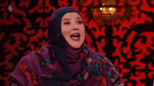 a woman in a hijab says hell no on a red background