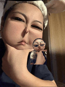 a woman wearing glasses and a headband looks at herself
