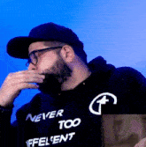 a man wearing a hoodie that says never too effective