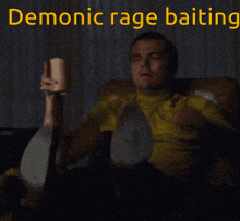 a man is sitting on a couch and pointing with the words demonic rage baiting behind him