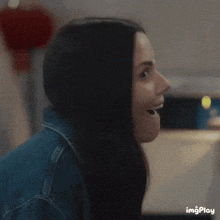 a close up of a woman 's face with the words imgplay in the corner
