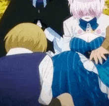 a man and a woman are sitting next to each other in a park .