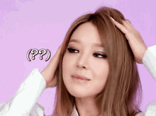 a woman touches her hair with a question mark above her head