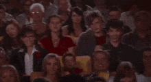a group of people sitting in a dark room with a sign that says chained by a voidshackle