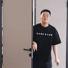 a man in a black shirt that says kuro game