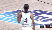 a basketball player with the number 4 on his back