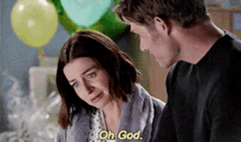a man and a woman are talking to each other and the woman says oh god .