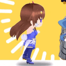 a girl in a blue dress is standing next to a man in a blue shirt .