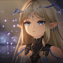 a girl with blonde hair and blue eyes is wearing a crown on her head