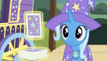 a cartoon pony wearing a purple hat is standing next to a card