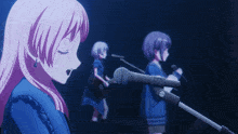 a girl with pink hair singing into a microphone while another girl plays a guitar