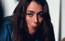 a woman making a face with her mouth open