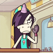 a cartoon character with a unicorn horn is sitting at a counter