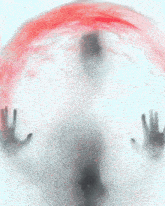 a person 's hands are visible behind a glass