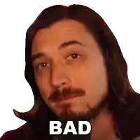 a man with long hair and a beard is looking at the camera and says bad