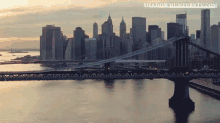 an aerial view of a city skyline with the website shadowhunterstv.com in the corner
