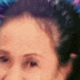 a close up of a person 's face with a purple background