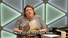 a man wearing a t-shirt with an eagle on it says nice to be me right now