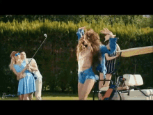 a group of people standing around a golf cart