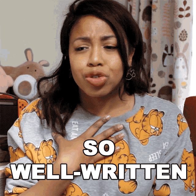a woman wearing a garfield shirt says so well written