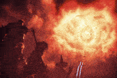 a man in a witch hat stands in front of a fireball