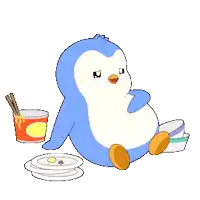 a blue and white penguin sits next to a cup of ramen