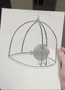a black and white drawing of a bird in a cage is being held by someone