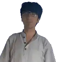 a young man wearing glasses and a white shirt looks at the camera