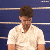 a man wearing a white shirt that says emirates