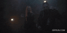 a gif from gifrun.com shows a man and a woman