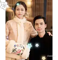 a man and a woman are posing for a picture and the word vivavideo is visible in the corner