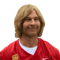 a man with blonde hair is wearing a red nike jersey with the letters sg on it