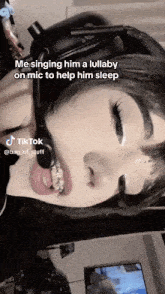 a woman singing a lullaby on a mic to help her sleep